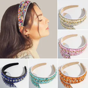 Detailed view of fashionable wide beaded headband with colorful rhinestones and sparkling stones.