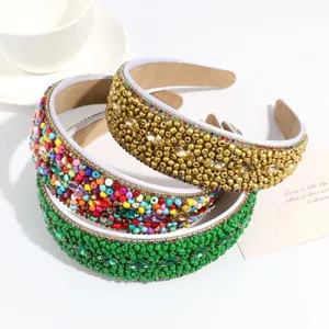Detailed close-up view of stylish wide headbands with rich colorful beads for daily wear.