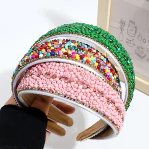 Detailed shot of wide beaded rhinestone headbands, colorful layered hair hoops for stylish wear.