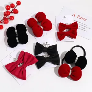 Velvet red and black bow hair clips with pearls and rhinestones, cute winter hair accessories detail.