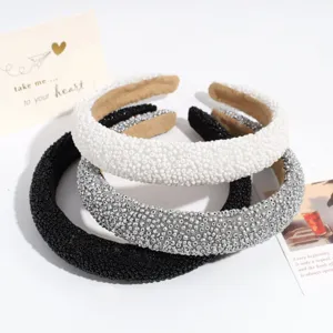 Detailed view of fashionable wide beaded headband, sparkling texture for daily elegant styling.