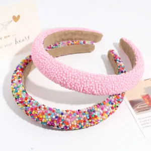 Beaded headband detail showing intricate colorful and pink micro bead craftsmanship closeup