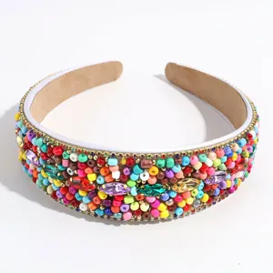 Close-up detail view of a wide colorful beaded and jeweled fashion hair hoop headband for women.
