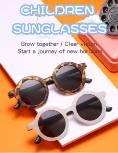 Gafas de sol redondas vintage para niños lindos en varios colores para protección solar.