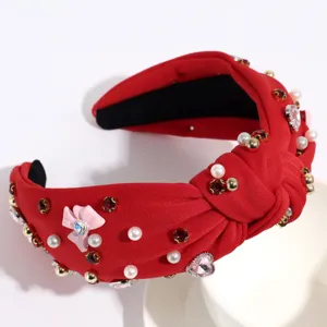 Serre-tête large rouge noué avec perles et strass, accessoire de cheveux élégant.