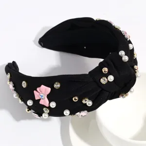 Serre-tête noué noir avec perles et strass, accessoire de coiffure tendance pour les femmes.