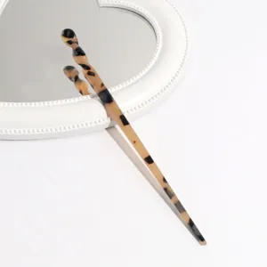 Tortoise shell acetate hair stick detail view, elegant minimalist hair accessory for buns.