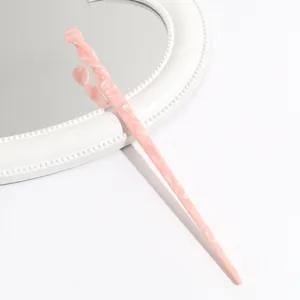 Pink acetic acid hair stick detail closeup showing unique twisted design for elegant hairstyles.