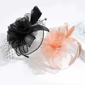 Elegant feather fascinator headband with floral mesh design, perfect for vintage tea party events.