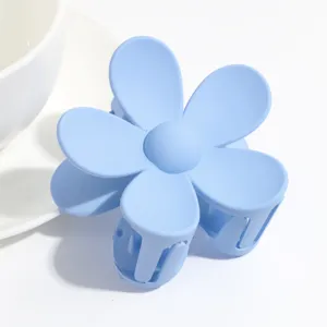 Light blue matte flower hair claw clip, cute pastel resin hair accessory for daily styling.