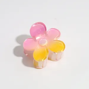 Detail view of the colorful gradient flower hair claw, showing close-up resin texture.