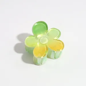 Gradient floral hair claw clip detail shot, glossy resin flower hair accessory for women.