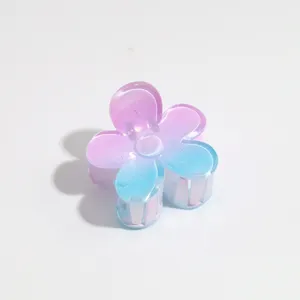 Gradient flower hair claw detail shot, pastel pink and blue hair accessory for sweet styling.