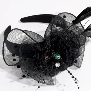 Detailed close-up of the elegant black feather mesh headband, exquisite party hair accessory.