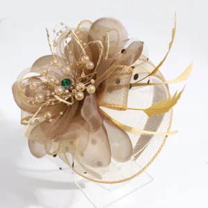 Close up shot of elegant champagne feather fascinator mesh flower hair hoop detail view