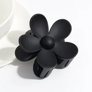 Matte black flower hair claw clip, elegant non-slip hair styling accessory for women daily use.