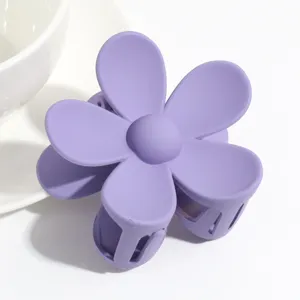 Cute matte purple flower hair claw clip, stylish sweet hair accessory for women daily styling.