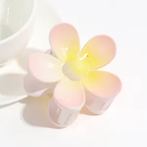 Gradient macaron flower hair claw clip with matte finish, cute daily hair accessory detail.