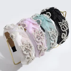Diadema de nudo de perlas elegante con diamantes de imitación para mujeres.