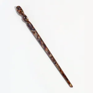 Elegant vintage acetate hair stick with unique twisted top design for stylish hair bun updos.