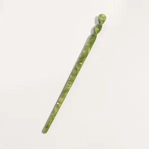 Elegant green cellulose acetate hairpin with unique twisted design for stylish vintage hairstyles.