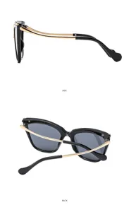 Vista detallada de gafas de sol de ojo de gato de moda con diseño de cruz dorada chic.