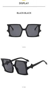 Stylish oversized black bat sunglasses with unique irregular frame for avant-garde daily wear.