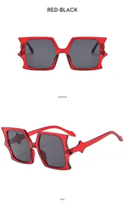 Trendy red bat shaped novelty sunglasses for women and men, cool fashion party eyewear.