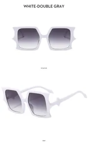 Stylish avant-garde white bat-wing sunglasses with gradient gray lenses for trendy streetwear.
