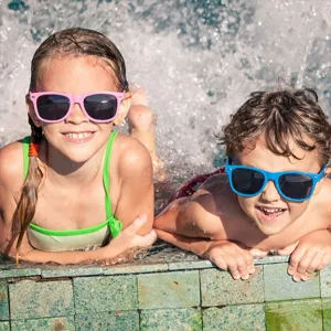 Details of colorful neon kids sunglasses, fun party eyewear for summer beach outdoor wear.