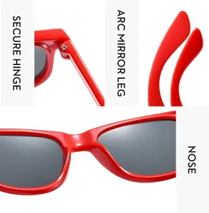 Detailed close-up view of kids red sunglasses highlighting secure hinge and mirror leg design.