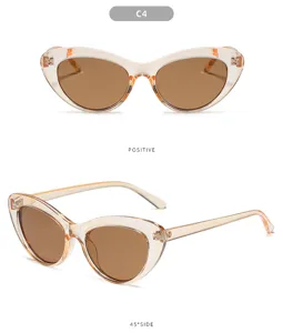 Occhiali da sole cat-eye alla moda da donna, montatura trasparente con lenti marroni.