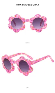 Detail view of kids pink flower sunglasses, cute floral frame design with double gray lenses.