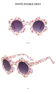Detailed view of children's floral sunglasses showing colorful print and frame design.