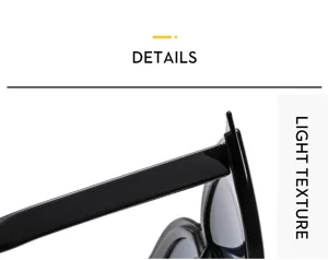 Vue détaillée des lunettes de soleil œil-de-chat noires, branches larges et finition brillante.