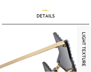 Rhinestone pentagram sunglasses detail shot, rimless design, gold metal temple arms.