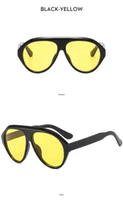 Gafas de sol deportivas Y2K de moda con montura negra y llamativos lentes de color amarillo.
