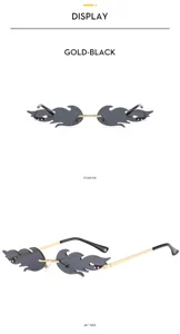Trendy flame shape rimless sunglasses with gold metal frame and dark grey lenses for women.