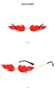 Flame shape rimless sunglasses detail view, red lenses with golden metal temples and tips.