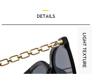 Primo piano dettagliato di occhiali da sole femminili con eleganti stanghette a catena.