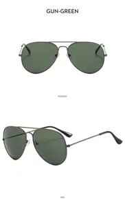 Detail view of men's gunmetal aviator sunglasses with classic green lenses and double bridge.