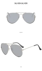 Detail view of stylish metal double-bridge pilot sunglasses with clear grey lenses.