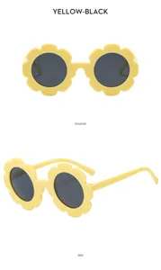 Süße Kinder Sonnenbrille in Blumenform Detailansicht, gelber Rahmen mit schwarzen Gläsern.