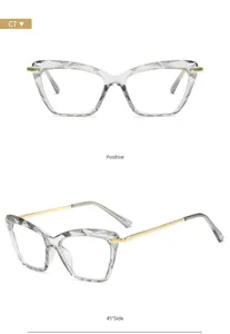 Lunettes de vue cat-eye à facettes en cristal transparent avec de fines branches dorées.
