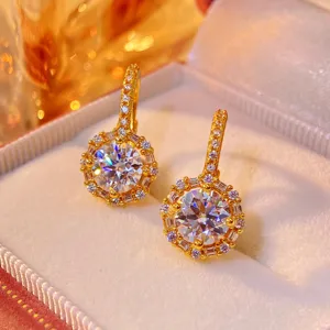 Exquisite moissanite halo earrings detail, brilliant round cut stones set in gold plated huggie.
