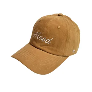 Brown corduroy baseball cap detail, featuring white embroidered letter Mood, casual style.