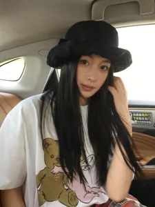 Details of Hepburn style black bucket hat, sun protection floral wide brim design.