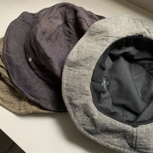 Detail view of Japanese style linen bucket hat, breathable pleated design, comfortable folding cap.