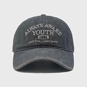 Detailed view of the vintage washed cotton baseball cap with stylish letter embroidery.