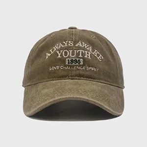 Vintage washed cotton baseball cap with embroidered lettering, casual sun hat for spring and summer.